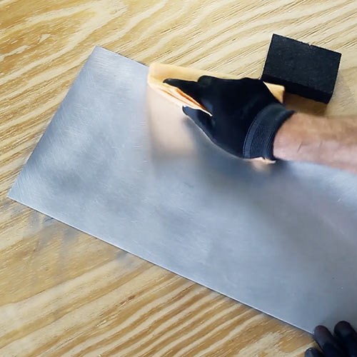 Cleaning and preparing a metal surface